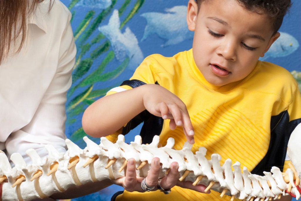 Child receiving safe pediatric chiropractic care promoting healthy development and wellness