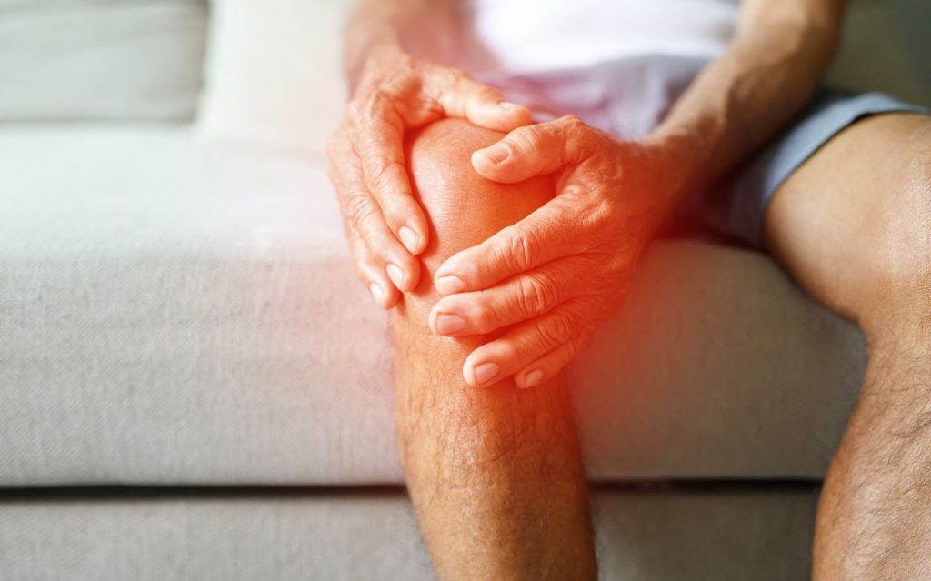 Person with arthritis joint pain receiving natural chiropractic relief treatment in Springdale Arkansas